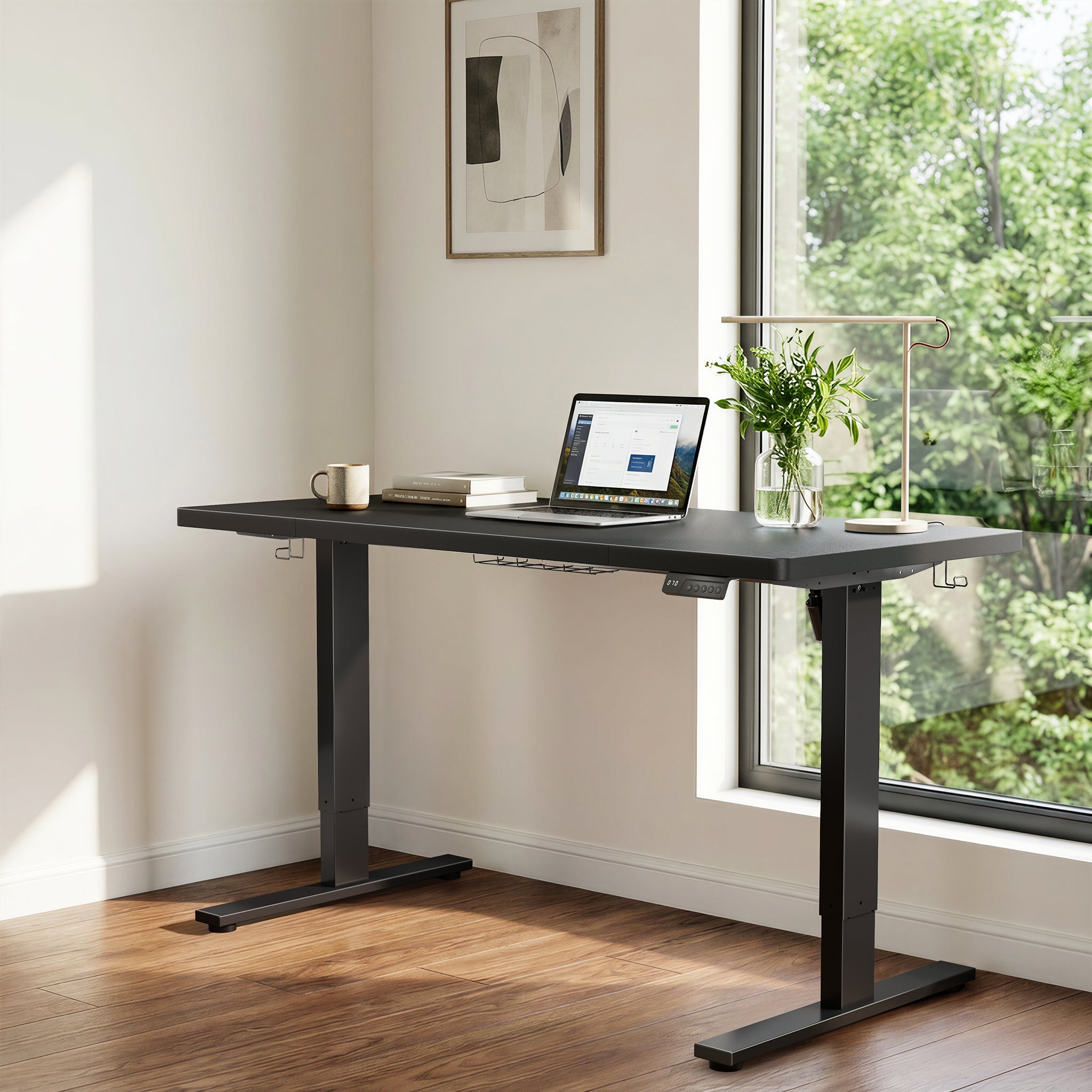 Black CabDesk D63 height-adjustable standing desk in a home office workspace #color_black