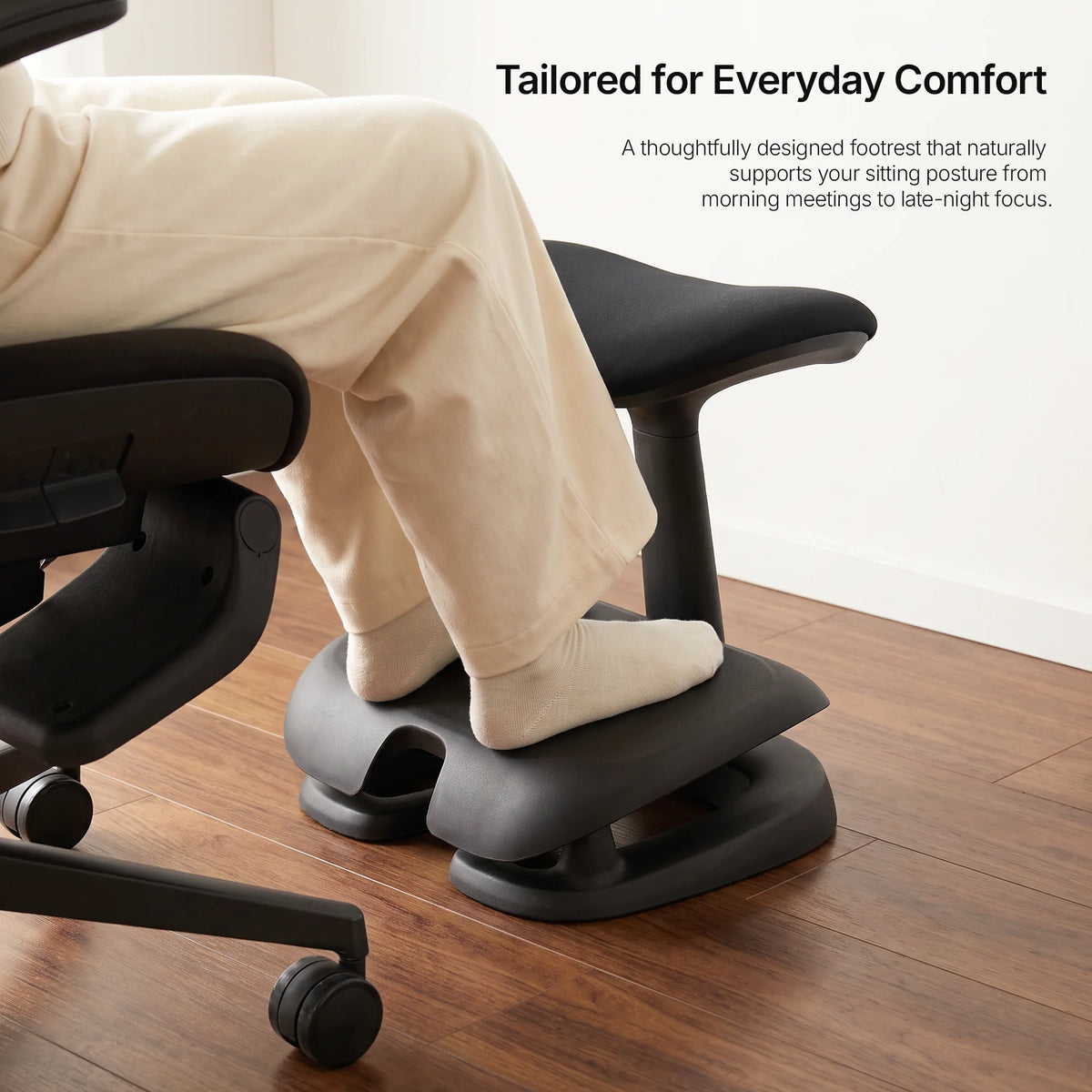 Cream Adjustable Under-Desk Footrest angled view showing contoured footrest and rocking base 