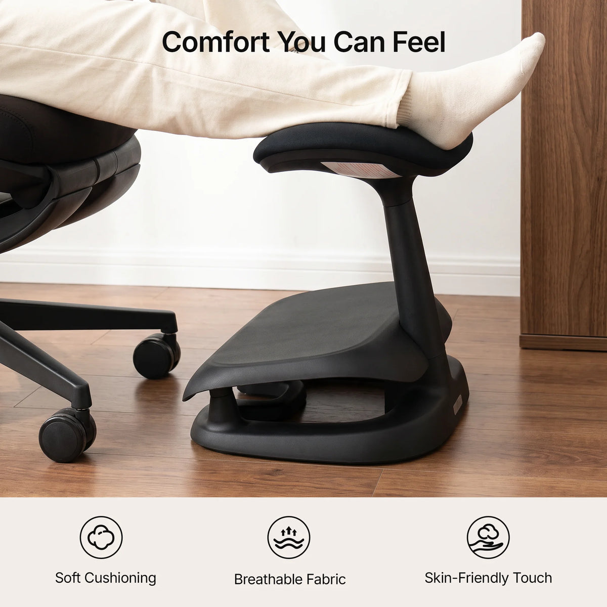 Cream Adjustable Under-Desk Footrest angled view showing contoured footrest and rocking base #color_black