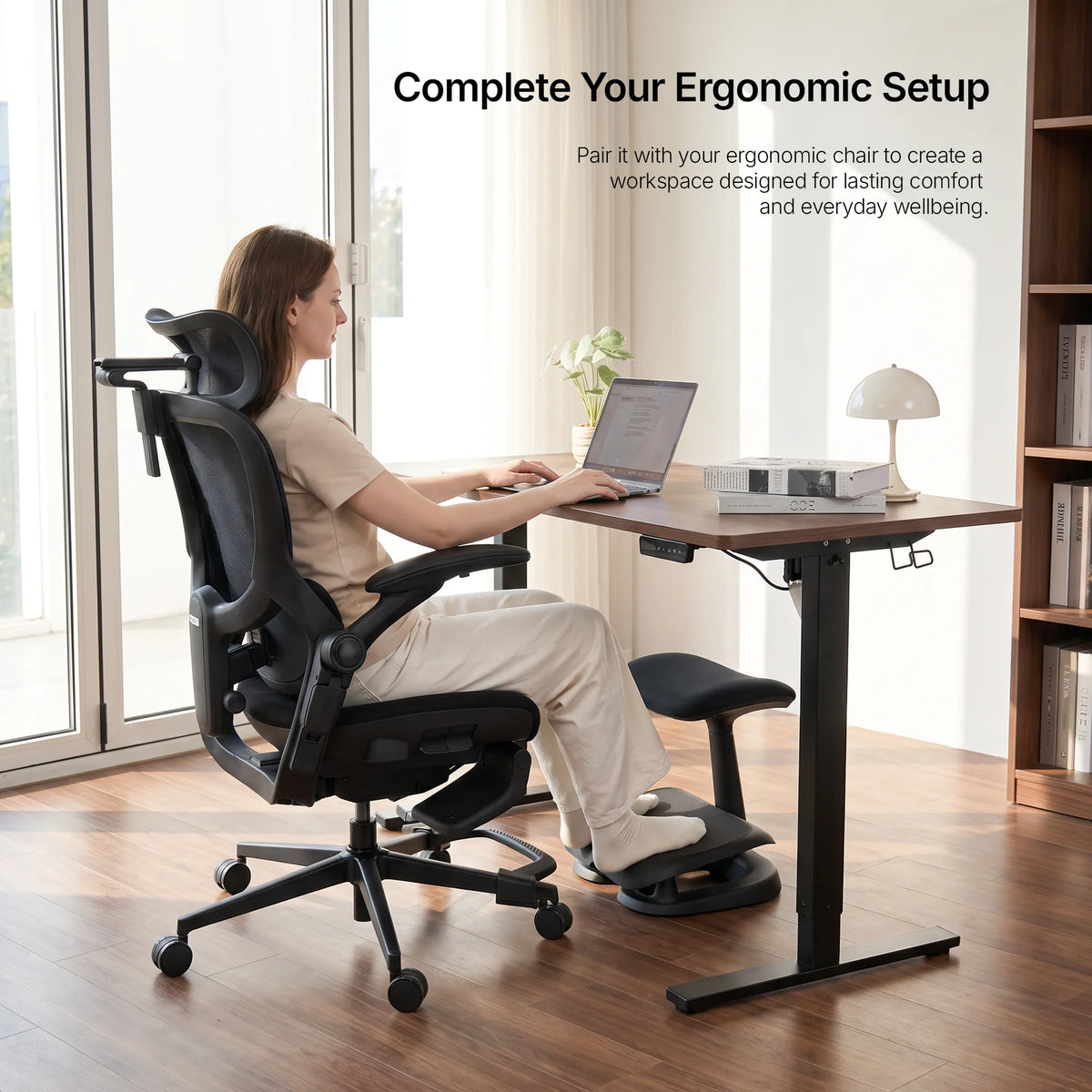 Cream Adjustable Under-Desk Footrest angled view showing contoured footrest and rocking base 