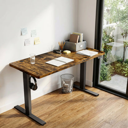 Brown CabDesk D60 height-adjustable standing desk in a home office workspace 
